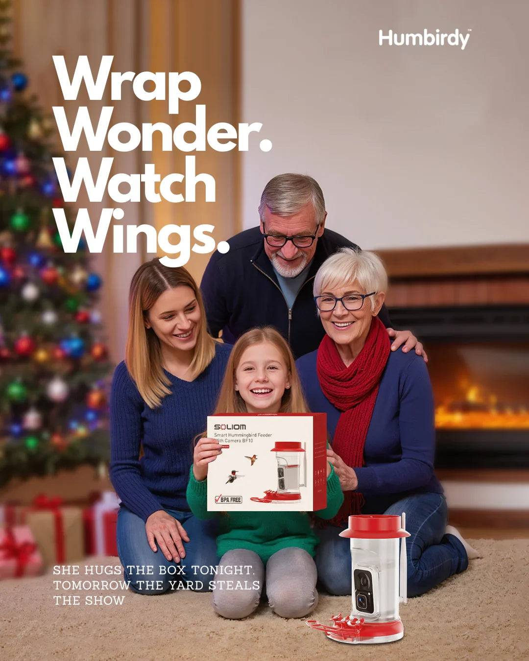 Family with a child holding a product, Christmas tree and fireplace in the background, Humbirdy brand visible
